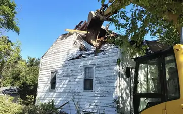 Excavator at a residential demolition jobsite