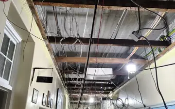 Interior stripped back to framing and ceiling during a renovation demolition