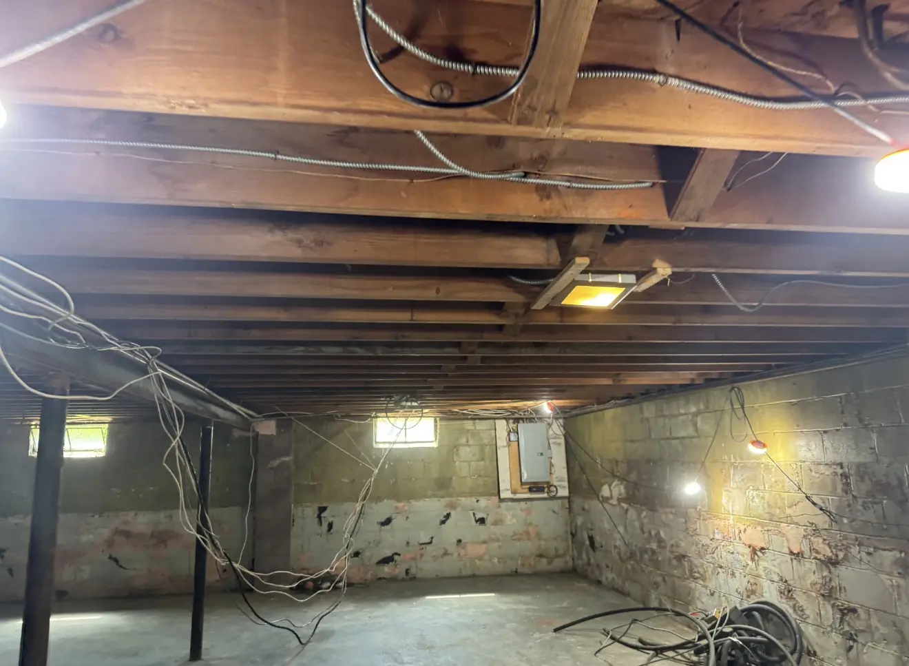 Home interior stripped to the studs and ceiling joists during demolition