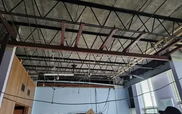 Commercial interior stripped to the steel structure during a build-out demolition